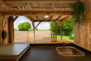The Village: kitchen with a sink and a window to the outside