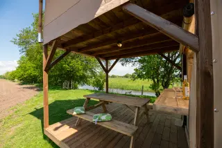The Village: picnic table under the roof of the deck