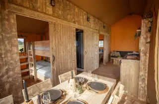 Glamping Lodge 35: dining area with a view of the bunk room