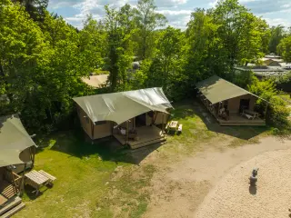 Luxury Safari Lodge: aerial view of two tents among the trees