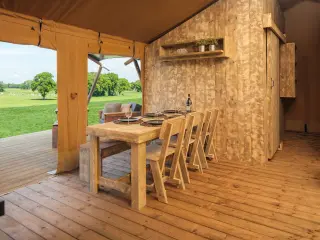Luxury Safari Lodge: wooden dining area by the front, open to the terrace