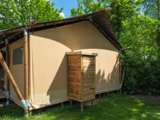 Luxury Safari Lodge: side with a canvas wall and a wooden cabinet