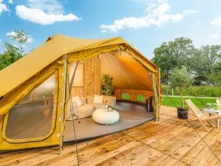 Billy-Joe Double Bell: the tent open, with cushions and a pouf inside