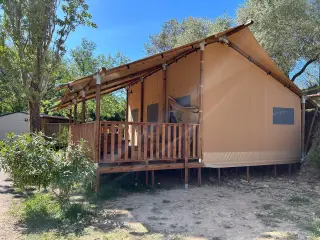 Glamping Lodge 35: side view of the raised terrace with a railing