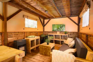 The Village: living area with a sofa and a stove