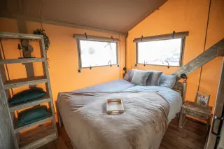 Glamping Lodge 35: bedroom with a double bed and two windows