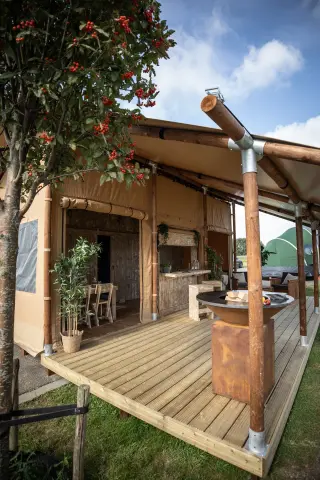 Glamping Lodge 35: wooden terrace under the eave