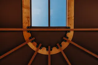 Arcade: detail of the arched frame and the window, seen from inside