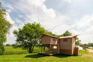 The Village: two-level glamping tent in a meadow